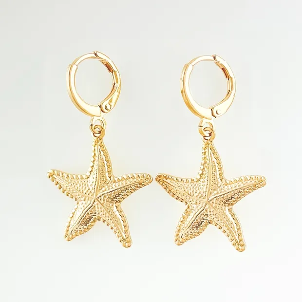 BRINCO TRANQUETA COM ESTRELA DO MAR