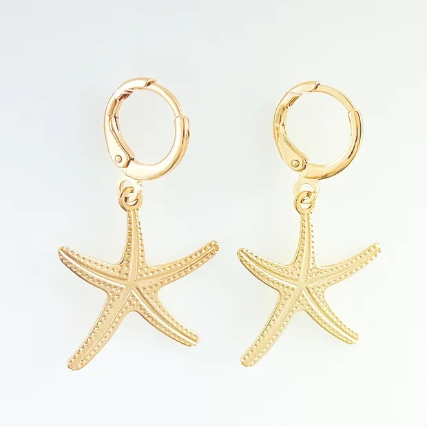 BRINCO TRANQUETA COM ESTRELA DO MAR