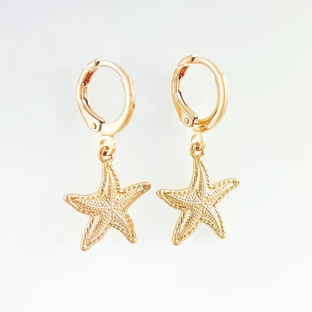 BRINCO TRANQUETA COM ESTRELA DO MAR